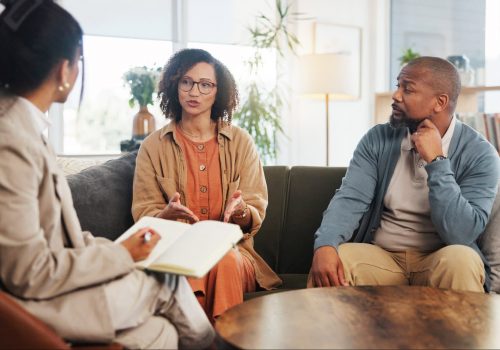 couple-therapy-and-conversation-with-notes-on-sof-2025-04-06-11-24-03-utc Couple, therapy and conversation with notes on sofa for marriage counseling, communication or suppo.