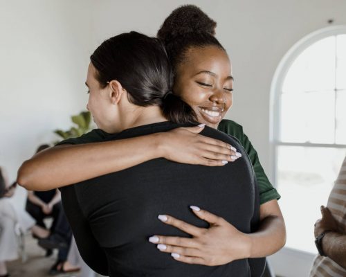 Diverse people in a supporting group session Diverse people in a supporting group session